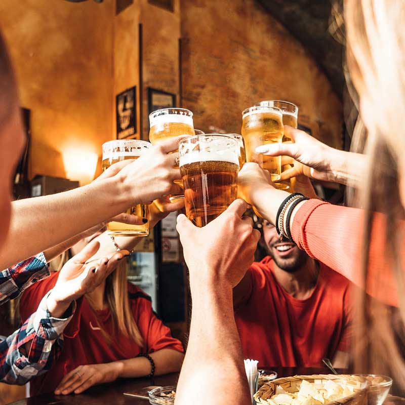 Friends toasting with Kildare Brewing beers